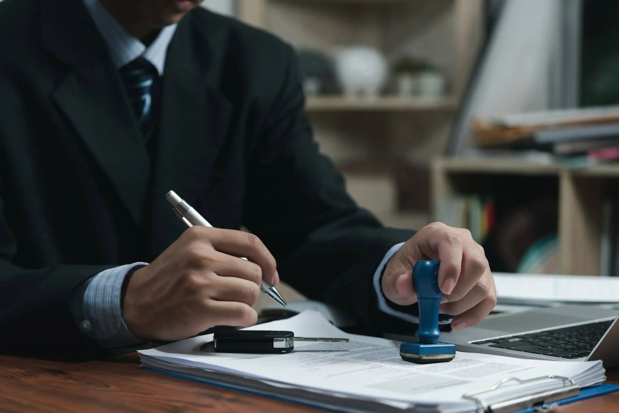 businessman-signing-a-contract-for-buying-of-selling-a-car-car-rental-service-insurance-and-contra.jpg